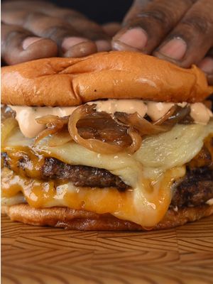 Double-stacked homemade smash burger  Yellow cheddar + white cheddar, perfectly melted, stacked between two smashed patties, jammy caramelized onions, toasted brioche, and my signature burger sauce bringing it all together. Burger Sauce (save this): Ingredients: • ½ cup gherkins, finely diced (dill pickles work too) • 1 cup mayo • ¼ cup Dijon mustard • 2–3 tbsp ketchup • 1 tbsp pickle brine • Salt, to taste • Fresh cracked black pepper • Hot sauce, to taste Method: 	1.	Finely dice the gherkins — smaller is better. 	2.	In a bowl, mix mayo, Dijon, and ketchup until smooth. 	3.	Fold in the diced pickles and pickle brine. 	4.	Season with salt, black pepper, and hot sauce. 	5.	Let it sit 15–20 minutes if you can (optional, but worth it). #EasyRecipes #smashburger 