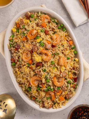 Leftovers never tasted so good 🤤🍚 @matthewchincreative 🇨🇦  RECIPE Ingredient list: ● 3 tbsp neutral oil ● 1 cup shrimp ● 1 cup pork or any leftover meat, diced ● 1 cup mixed vegetables ● 3 eggs ● 3 cups leftover rice ● 2 tbsp soy sauce ● Salt and white pepper (or black pepper) to taste ● 1 tbsp sesame seed oil ● 2 tbsp green onions Instructions: 1. In a large frying pan or wok, pour 1 tbsp oil. 2. Add your shrimp and season with salt and pepper. Stir, then add leftover meat and mixed vegetables. 3. Stir until moisture evaporates and remove from the pan. 4. Add remaining oil, whisked eggs and pour into the pan. Scramble eggs using a spatula and set to one side of the pan. 5. Add rice and mix well, breaking up any clumps in the rice. 6. Add filling back to the pan and mix until well combined. 7. Add soy sauce and toss to combine. 8. Remove from heat, add sesame seed oil, green onions, remove mix and serve.