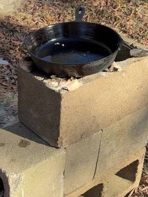 Building a rocket stove with cinder blocks! Easy to do. #fyp #stove #howto #cooking 