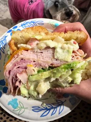 BIG. FAT. HOMEMADE SANDWICH 🥪😮‍💨 Buttered & toasted sourdough + stacked fillings = elite behavior. INGREDIENTS: • Sourdough bread, buttered & toasted • Turkey • Ham • Havarti cheese • Sharp cheddar cheese • Avocado Lettuce Slaw: • Shredded lettuce • Diced Roma tomato • Mayonnaise • Olive salad • Submarine dressing HOW TO: Toast sourdough in butter until golden. Layer turkey, ham, Havarti & sharp cheddar. Add sliced avocado. Toss lettuce, tomato, mayo, olive salad & sub dressing together, pile it on, close it up, and press lightly. Warning: this sandwich will ruin basic sandwiches for you 🥪🔥 #SandwichRecipe #HomeCooking #FoodReels #SourdoughBread #DeliStyle  