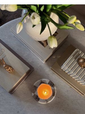 See anything you love? Links will be on my @shopltk just search for “Homewithcarolina_”  ✨ ROUND coffee table styling 101 ✨ I’ve often get asked “how do you style a round table?” I’m sharing how to properly style your table without making it feel awkward and unbalanced!  Step 1: Coffee table books! The foundation and key to making it feel designer! Use neutral books with darker tones for that added contrast and divide them in 3. You can leave them in all similar heights or make one section lower with a higher elevated container. If you choose to go with all at same height make sure your object is either flat or doesn’t have too much height to it. (Like a tray, small Chain, unique object, etc.)  Step 2: Add a floral arrangement in a vase OR you can just do a vase. This adds height!  Step 3:  Add a fourth element (it’s important you divide in 4 otherwise it will feel unbalanced) this can be a small tray (round or rectangular) and add a candle on top to add that warmth and cozy feel to it.  (Optional) add seasonal decor whether it’s the floral arrangement itself or like I did here and added small bunnies for Easter. I went with gold to add a mix of tones!  Found this helpful?  💾 Save this post so you can come back to it whenever you are ready to style your table! New here? Hi! I’m Carolina and I’m an interior designer who does this for a living! I love sharing styling tips and affordable yet luxurious home finds so that you can also style your home like a Designer!  If you loved this video! Please don’t forget to like & share with a friend who you may think would love this, and Follow along & hit that bell icon to get notified when I share my next tip or affordable find! Direct URL - https://www.shopltk.com/explore/Homewithcarolina_/posts/66e2a608-0505-11f1-9ca3-0242ac110003 #RoundCoffeeTable #HomeStylingTips #DecorInspoDaily #HomeCreators #fyp 