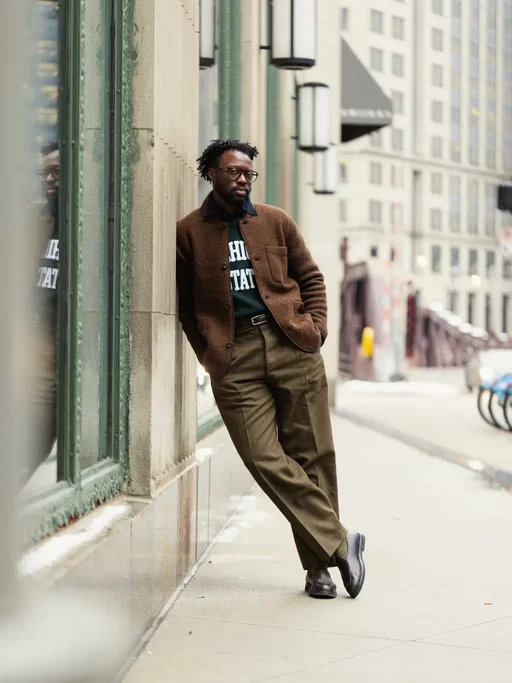 Day 3 at @extraitastyle during Chicago Collective and I went back to my comfort zone: preppy structure meets workwear function. The foundation is a pair of thrifted French Army M52 wool trousers from the ’50s/’60s. Real military chore pants. Heavy, intentional, built to last. This is why I’m always talking about fit, fabric, and function before anything else. I kept the palette tight and let texture do the work, then added just enough contrast with a touch of denim under a brushed wool sweater. Nothing random here. Once you understand how clothes move and wear, putting outfits together stops feeling forced. This look sums up what I’m aiming for long-term: personal uniforms that feel natural, repeatable, and sharp without overthinking it. If any part of this fit speaks to you, comment “LINK” and I’ll send over the full outfit details. #menswearstyle #menswearblogger #workwearstyle #preppystyle #mensfashiontips  