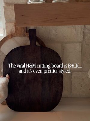 The viral H&M cutting board is officially restocked — and it’s the easiest way to elevate your kitchen decor. Styling it with layered cutting boards or a fun checkered board like the one shown here from @magnolia, mini board coasters, and a round marble tray with salt and pepper grinders, and of course a cute lamp for a designer, lived-in countertop look. Affordable, aesthetic, and perfect for modern kitchen styling. Links can be found in my shopLTK just search for my name “homewithcarolina_”  Or copy and paste this URL - https://www.shopltk.com/explore/Homewithcarolina_/posts/3fc11a3c-06d0-11f1-aa5e-0242ac110003 #KitchenDecorIdeas #HomeStylingInspo #ViralHomeFind #HMHome #KitchenCounterDecor ModernHomeStyle LTKHome HomeFinds AffordableHome