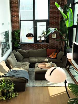 calm •  mid-century modern | toronto interior | brick loft living | warm light | lived-in spaces | hard loft | tall ceilings | large windows | natural light | vintage furniture | statement lighting | plants | architectural details | open living | modern apartment | home atmosphere | interior styling | design focused | quiet spaces • • #interiordesign #apartmentdecor #homedecor #homeinspo #homebody 
