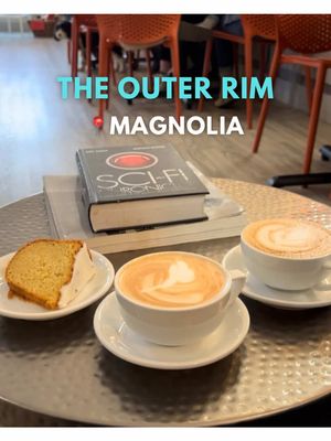 [hosted] If you’ve never visited The Outer Rim, a sci-fi coffee shop in Seattle’s Magnolia neighborhood, make your way in. They have room to park your spaceship! Owners Rebecca and Martin Kuenn decked out the spaceship (I mean, coffee shop) with Star Wars and Star Trek-themed decor. There’s even a mural in the bathroom. They have a large selection of house-made pastries and creative coffees like the Vulcan Mind Meld and the Skywalker.  On this visit, we had: 🔸 Lemon lavender coffee cake 🔸 Romulan Cloaking Device (toasted marshmallow and hazelnut latte) 🔸 Tractor Beam (chocolate and blood orange mocha) The cafe has WiFi, a few books and board games, and several tables, so it’s a nice, chill hangout for small groups or quiet work time.  For small businesses like this, foot traffic and repeat customers are important, so please come and support one of the coolest coffee shops in Seattle’s galaxy! The Outer Rim recently celebrated their third anniversary! 🎉 I’ve featured them in a past video and really enjoy this cafe, and the team invited me in to highlight the shop for the anniversary. Many thanks to them for hosting my husband and me. 🧡 📍The Outer Rim - 2821 Thorndyke Ave W, Seattle, WA (Magnolia) There is plentiful, easy, FREE parking 🅿️  💵 Price range: Expect to spend $10-$12 per person if you order coffee and food  Share this video with someone you’d bring for a coffee outing! … … #seattletiktok #seattlecoffee #seattlefoodie #scifi #starwars  Unique coffee shops in Seattle, where to get coffee in Seattle, themed coffee shop, themed cafe, Star Trek decor, Seattle recommendations, Seattle hidden gems 