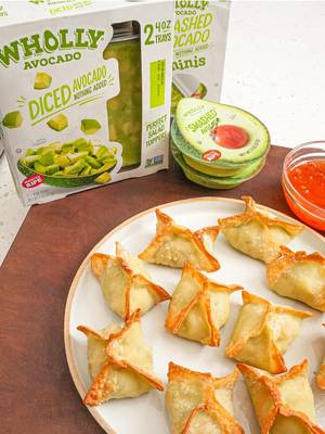 #WHOLLYBrandPartner We’re back with another Lunar New Year recipe and today I’m making these DELICIOUS Air Fryer Avocado Crab Wontons with @WHOLLY® Guacamole Diced Avocado, made from real, ripe, hand-scooped avocados and no preservatives added to 
 make this filling full of good stuff! Dip them in some sweet chili sauce for a perfect Lunar New Year appetizer! 
 Makes about 30 wontons
 8 oz imitation crab, roughly chopped (you can also use real crab)
 8 oz WHOLLY® Diced Avocado or WHOLLY® Smashed Avocado
 4 oz cream cheese, softened
 2 green onions, chopped
 2 cloves garlic, grated
 ½ tablespoon Shaoxing wine
 ½ tbsp sesame oil
 ½ tbsp sugar
 ½ tsp kosher salt
 ½ tsp white pepper
 1 package wonton wrappers
 Neutral oil spray
 Sweet Chili Sauce for dipping 
 1. In a large bowl, add the imitation crab, cream cheese, WHOLLY® Diced Avocado, green onions, garlic, Shaoxing wine, sesame oil, sugar, salt and white pepper. Gently fold the filling with a spatula or your hands until just combined. 
 2. Place 1 tablespoon of the filling in the middle of the wonton wrapper. Wet your fingers with water and paint the edge of the wonton wrapper, then fold and pinch the 
 opposite corners of wonton wrapper together to seal the dumpling, allowing any excess air to escape. Repeat until all the wontons are folded. 
 3. Spray the wontons with a neutral oil spray, then air fry at 350°F for 5-6 minutes until golden brown and crispy. Serve with sweet chili sauce and enjoy
