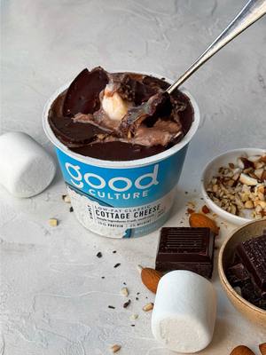 the sweet tooth won today. Rocky Road Cottage Cheese Cup Cottage Cheese Cup Ingredients:  • 1 single serve cup of Good Culture Simply 2% Cottage Cheese • 1 tbsp of cocoa powder  • 1 tsp maple syrup  • 1 large marshmallow or 6 mini marshmallows • 1 tbsp of chopped dark chocolate  • 1 tbsp of chopped toasted almonds  Dark Chocolate Almond Magic Shell Ingredients: • 1 tbsp of chopped dark chocolate  • ½ tsp extra virgin cold pressed coconut oil  • 1 tsp finely chopped toasted almonds  • Flaky Salt Method: 1. Add cottage cheese, cocoa powder, maple syrup, vanilla extract and salt into a blender. Blend until completely smooth. 2. Use a pair of kitchen scissor to cut up the marshmallow/s into small pieces. 3. Add the marshmallow, chopped chocolate and almonds into the whipped chocolate cottage cheese mixture and give it a mix until combined. 4. Fill up your single serve cup with the chocolate blended cottage cheese. 5. In a small microwave safe bowl, add the dark chocolate and coconut oil. 6. Microwave the dark chocolate in 15 second increments until the chocolate is just starting to melt. Give it a good stir until smooth and creamy. 7. Add the chopped toasted almonds into the chocolate and give it a mix. 8. Pour the almond chocolate over the blended cottage cheese, top with a sprinkle of flaky salt and pop it into the freezer for about 15 – 20 minutes and you’ll be left with a crackly chocolate topping. Break in with a spoon and enjoy!