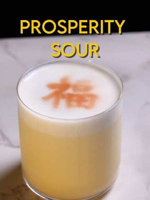 Prosperity Sidecar Happy Chinese New Year! A quick edit to the whisky sour with the help of a lemon-mandarin-yuzu juice blend, originally from Caer Maiko. The sour is finished with a spritz of angostura bitters over the 福 stencil,  symbolizing fortune and prosperity. 2 oz Whisky 1 oz citrus blend .5 oz simple syrup .5 oz egg white Dry Shake, then shake with ice until cold. Double strain into a rocks glass, garnish with angostura bitters Citrus Blend -  4 parts lemon, 3 parts mandarin, 1 part yuzu juice by volume #cocktails #chinesenewyear #fyp
