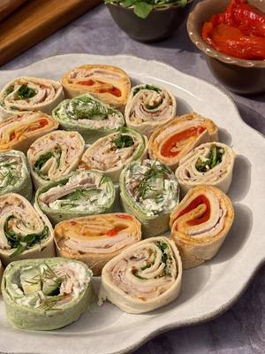 A simple lunch made better with Boar’s Head® 😋 Roll Up 1: 🌶️ 3 slices Boar's Head® Bold PitCraft® Slow Smoked Turkey Breast 🌶️ Boar's Head® Roasted Red Pepper Hummus 🌶️ 3 slices Boar's Head® Smoked Gouda Cheese 🌶️ 1-2 roasted red peppers 🌶️ Whole Wheat Tortilla Roll Up 2: 🥒 3 slices Boar's Head® Bold PitCraft® Slow Smoked Turkey Breast 🥒 Boar’s Head® Tzatziki 🥒 Boar’s Head® Feta Cheese 🥒 English cucumber, sliced into spears 🥒 Fresh dill, chopped  🥒 Spinach Tortilla  🥒 Additional fresh dill, for garnish Roll Up 3 🌿 3 slices Boar's Head® Bold PitCraft® Slow Smoked Turkey Breast 🌿 Boar's Head® Everything Bagel Hummus 🌿 2 slices Boar’s Head® 33% Lower Fat & 36% Lower Sodium American Cheese* - White 🌿 Arugula  🌿 White Tortilla  🌿 Everything bagel seasoning, for garnish #BoarsHead #Foodie #Deli #rollups #turkeyrollup *33% Lower Fat, 36% Lower Sodium 36% Lower Sodium than the USDA data for Pasteurized Process American Cheese. Contains 300mg of Sodium and 6g of Total Fat compared to 470mg of Sodium and 9g of Total Fat per 1oz serving of Regular Pasteurized Process American Cheese 