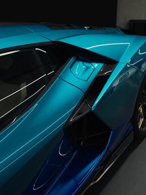 This Lamborghini Revuelto in a fading from Blu Vathys to Blu Uranus catches  attention with every curve. And reflection. Take a moment to enjoy this unique #AdPersonam design, detail by detail. #Lamborghini #Revuelto #FromNowOn