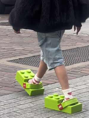 @Crocs x @LEGO really said "I'm 2 blocks away" with their debut collab 🧱 We just stepped out to see the public's opinion of the shoe first-hand... and it's safe to say they turn some heads.  Would you walk a mile in these? 💚 Credit: Hypebae