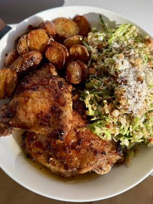 Roasted Herby Lemon  Chicken Thighs and Caesar Brussels Sprouts Salad 	 Recipe: 2 pounds Chicken Thighs:		 3 tablespoons olive oil		 1 teaspoon onion powder		 1 teaspoon garlic powder		 1 teaspoon red pepper flakes		 1 teaspoon dried oregano	 1 1/2 teaspoons salt  1/2 teaspoon pepper	 1 lemon, zested  1/2 a lemon, squeezed	 -Preheat oven to 425°F. Add olive oil, seasonings, lemon zest and juice to a bowl. Mix. Add chicken and coat all sides. Place chicken in an oven safe baking dish and cook for 30-40 minutes, until internal temperature reaches 165°F and skin is crispy. 1 pound Mini Red Potatoes: 2 tablespoons olive oil 1 teaspoon paprika 1 teaspoon onion powder 1 teaspoon garlic powder 1 teaspoon salt 1/4 teaspoon pepper -Cut potatoes in half and add to a pot with water. Season with salt and boil until almost fork tender. Drain and place potatoes on a baking sheet. Cover potatoes with olive oil and seasonings. Bake in the preheated oven for 20-25 minutes or until they reach desired crispiness. Caesar Brussels Sprout Salad:  2 pounds brussels sprouts, finely chopped Crouton Crumbs: 1/2 a baguette, cut into cubes 2 tablespoons olive oil  1/4 teaspoon salt 1/4 teaspoon pepper 1/2 teaspoon garlic powder 1/2 teaspoon onion powder  -Add bread to a bowl and coat with olive oil and seasonings. Pour onto a baking sheet and bake for 8-10 minutes, until crispy and golden. In a food processor, add croutons and pulse to create crouton crumbs.  Caesar dressing:  1 teaspoon anchovy paste   2 teaspoons dijon mustard  5 garlic cloves, minced  1/2 cup mayonnaise 1 teaspoon Worcestershire sauce 1/4 cup lemon juice 3/4 cup Parmigiano-Reggiano, grated  1/4 teaspoon salt 1/4 teaspoon pepper -In a bowl, add anchovy paste, mustard, and garlic. Whisk together. Add mayo, Worcestershire sauce, lemon juice, 1/2 cup Parmigiano-Reggiano, salt, and pepper. Whisk until fully combined. -In a large bowl, add Brussels sprouts and toss in Caesar dressing, crouton crumbs, and remaining Parmigiano-Reggiano. Enjoy! #quickrecipe #foodies #healthy #foodtiktok 