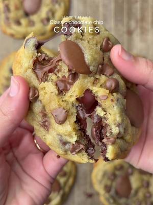 Classic chocolate chip cookies 🤤 Yields: 15-16 Cookies INGREDIENTS:  230g Cold Chopped Unsalted Butter  160g Caster Sugar  160g Light Brown Sugar  450g Chocolate Chunks or chips  475g Plain Flour  1 tsp Salt 3 tsp Baking Powder  3/4 tsp Baking Soda  2 Eggs  1 Egg Yolk  1 tsp Vanilla  INSTRUCTIONS: •In a large mixing bowl, add the cold cubed butter and whisk until slightly creamy. Add the white sugar and light brown sugar, then whisk together until well combined and fluffy. •Add the eggs, vanilla extract, and chocolate chips or chunks. Whisk until fully incorporated. •Add the flour, baking powder, baking soda, and salt. Gently mix until just combined, do not overmix. •Portion the dough into 75-80g balls. •Place the cookie dough balls onto a tray and freeze for at least 30 minutes (or overnight for best results). •Preheat oven to 165-170C. Bake for 10-15 minutes or until the tops are lightly golden while the centres remain soft. •Remove from the oven and let cool slightly. •Serve warm with ice cream. NOTE: Store any extra dough balls in an airtight container or freezer bag and freeze for later. Whenever a cookie craving hits, bake straight from frozen🫶🏻 #cookie #chocolate #fyp #explorepage✨ #viralvideos 