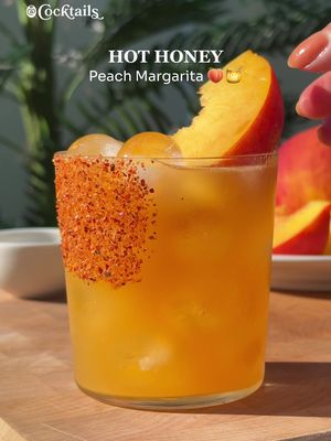 Happy National Margarita Day! 🍋‍🟩✨ Ingredients: - 2 oz. peach purée  - 1.5 oz. tequila - .5 oz. Cointreau  - .5 oz. lime juice - a few dashes of hot honey - rim glass with hot honey and Tajín - garnish with a peach slice  #nationalmargaritaday #margarita #hothoney #peach #cocktails