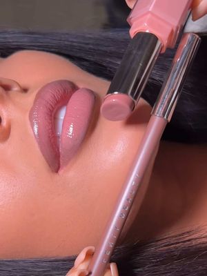 When the lip combo is combo-ing 🫦✨ Neutral lips never looked this good 💅🏽💅🏿💅🏻 @emmamakeup_x is lining her lips with Trace'd Out Lip Liner in 'Extra Thigh' + topping with Gloss Bomb Stix in 'Blaz'd Donut'  What's your favorite Fenty lip combo?  Tap the 🔗 in bio to secure ya Fenty #lipcombo 💋