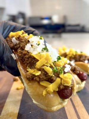 I grew up thinking everyone knew the difference… turns out we’ve been living a lie. Somewhere along the way people started putting regular chili on hot dogs and nobody stopped it. 😂😩🌭 Hot Dog Chili Recipe Ingredients: 1 medium onion, grated 3 lbs ground beef 1 cup beef stock 2 cups water 1 tablespoon salt 1 tablespoon black pepper 1 tablespoon garlic powder 1 tablespoon smoked paprika 1 tablespoon sugar 4 tablespoons chili powder 2 tablespoons Worcestershire sauce 2 tablespoons ketchup 1 teaspoon cayenne pepper 2 tablespoons tomato paste Instructions: Place the grated onion, ground beef, beef stock, and water into a large pot over medium high heat. Break the meat up in the liquid as it cooks until it becomes very fine and minced. Add the salt, pepper, garlic powder, smoked paprika, sugar, chili powder, Worcestershire sauce, ketchup, and cayenne pepper. Mix well and bring everything to a boil. Once boiling, place the lid on slightly tilted, reduce the heat to medium low, and let it gently simmer for about 30 minutes. Stir in the tomato paste until fully smooth and incorporated. Let the chili cook for another 15 minutes, then skim the grease from the top and continue stirring until you reach your desired consistency. This chili is even better the next day after the flavors have had time to develop. #hotdog #chili #beef #food #foodtiktok 