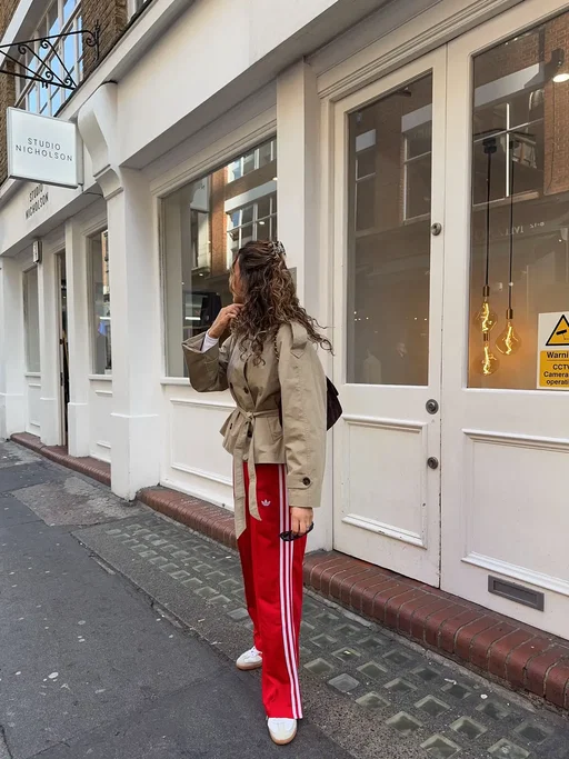 A spring outfit formula I’ll be wearing on repeat because cool girls rewear their clothes: long sleeve white t-shirt, adidas Firebird track pants , funnel neck cropped trench coat & adidas samba trainers.  #OOTD #adidastrackpants #springoutfitinspo #croppedtrenchcoat #springoutfits 