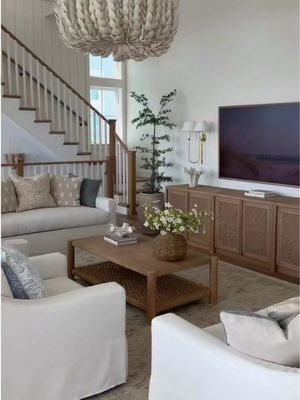 "My dream living room from Pottery Barn 🐚 The York Sofa, York Chairs, and woven details all create the dreamiest beach house living room. We have fallen in love with the York Sofa- it’s VERY comfortable & has performance fabric so stains & spills clean up easily 🙌🏻" -@Emily Travis #mypotterybarn 
