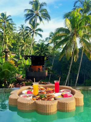 You & me + Bali pool day? Location below👇🌺   📍 @Cretya Ubud is home to a 3 layered blue pool, 2 hot tubs, famous Bali swings, and a breathtaking view of lush green rice terraces.  🤯 This luxury, bucket-list floating breakfast was only $25 per person and we had private access to this beautiful day club before it opened.   🥐🍳🍹🍉The floating breakfast came with refreshing acai bowls, fresh pastries, fresh squeezed juice, lattes, avocado toast, bacon, sausage, eggs, salad, tropical fruit, the most delicious potatoes, and more!   🌞 The food, the views, the rays of sunlight coming through the jungle... it truly was one of the most magical experiences of our lives!   🫶🏼 Send this to someone you’d love to have a floating breakfast in Bali with.  #bali #ubudbali #floatingbreakfast #indonesia #poolday