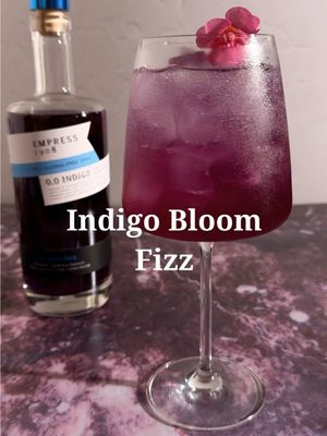 #Ad Spring glow powered by @Empress 1908 Gin 0.0 Indigo ✨💜 The Indigo Bloom Fizz is floral, fizzy, and glowing.  1.5 oz Empress 1908 0.0. Indigo  .75 oz lavender syrup .75 oz yuzu juice 3 oz butterfly pea flower tea  2-3 oz sparkling water  Edible flower for garnish  In a cocktail shaker, combine Empress 1908 0.0, lavender syrup, yuzu, and butterfly pea flower tea, fill with ice wand shake until cold. Strain into a glass filled with ice. Top with sparkling water and garnish. 
