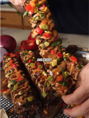 Tortilla Beef Kebabs Recipe: -In a bowl mix together: 2.5 lbs ground beef 1 chopped red bell pepper 1/4 chopped red onion 4 minced garlic cloves 1/3 cup chopped green onion 2 tbsp paprika 1 tbsp cumin 1 tbsp garlic powder 1 tbsp oregano 1 tbsp pepper 1 tbsp salt -Cut the ends of large tortillas off to make a square shape. -Add a thin layer of the beef mixture to 6 tortilla squares. -Stack them on top of each other and cut into 4 sections. -Flip them onto their side and then stick 4 skewers into the stack. -Cut in between skewers to make kabobs. -Sear on each side until 165F internal while painting with chili oil. -Top with burger sauce and chopped peppers and onions for toppings.