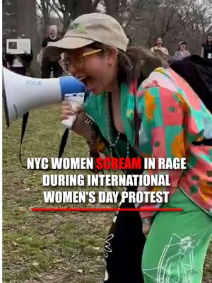 'GET MAD': Woman encourages others to 'scream,' 'bounce,' and 'get mad' during International Women's Day protest in New York City's Central Park.