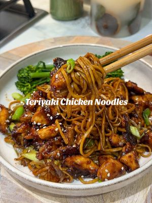 TERIYAKI CHICKEN NOODLES  The perfect weekend Fakeaway, quick, easy & delicious. Has the flavours of a Chinese take out, but made at home in under 20 minutes 🥡🥢. Ingredients for 2 For the chicken: - 350g diced chicken thighs  - 2tbsp cornflour - Tsp garlic granules & paprika For the sauce: - 2tbsp teriyaki - 2 crushed garlic cloves - 3tbsp soy sauce - Pinch chilli flakes - Tsp cornflour mixed with water For the noodles - 2 nests of dry noodles - 1 sliced onion  - 2 spring onions - 2tbsp dark soy sauce - 1tbsp sesame oil Mix all the sauce ingredients together in a bowl. For the chicken use some kitchen roll to get rid of an excess moisture from the chicken. Then toss this in the cornflour and spices. Add a couple spoons of the sauce ingredients and stir. Then get a frying pan nice and hot with lots of low cal cooking spray, once the pan is hot add the chicken and make sure it’s not over crowded and try not to move the chicken too much. Leave it a good 2-3 minutes to cook on each side, so that it goes nice and crispy. When the chicken is almost cooked, reduce the heat of the pan and the sauce and leave this to simmer until it’s thickened and sticky. For the noodles, boil some water and add your noodle nests this takes around 5 minutes. In a wok fry the onion and whites of the spring onion. once soft add the greens of spring onion and cooked noodles, along with sesame oil and soy sauce and stir until the noodles are coated. Serve in bowls with the chicken on top and a sprinkle of sesame seeds and sliced spring onion. #teriyakichicken #EasyRecipes #quickrecipes #DinnerIdeas #fyp 