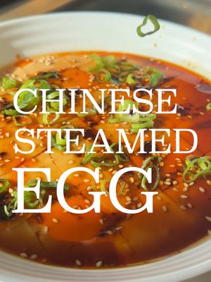 CHINESE STEAMED EGG 🥚🌶️ RECIPE ⬇️ One of my all time favourite breakfasts. Super simple, packed with protein, and absolutely delicious.  - Crack 3 eggs into a bowl, weigh them (write it down), and mix - Zero the scales, and then add warm (not hot!) chicken stock until you have a ratio of 1 part egg to 1.5 parts stock (take the weight of your eggs and multiply by 1.5, and add that amount of stock. For example if you have 170g eggs, you need 255g stock) - Gently combine without causing bubbles, and pass through a sieve - Heat a bowl in a steamer (critical!). Then add eggs to the bowl, cling film the top, and steam for 10 minutes. Turn heat off and sit in steamer for further 5 minutes - Slice the cooked egg, and add sesame oil, sesame seeds, chilli oil, soy sauce, and spring onion #egg #breakfast #china #cooking #steamedegg 