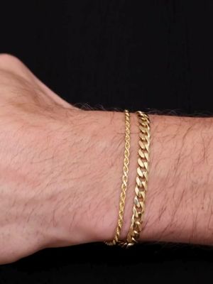 The Gold Cuban Rope Bracelet stack features two of our best selling chain bracelets combined for the perfect look. Each piece is handmade by expert craftsmen in Tuscany, Italy. They’re waterproof & sweatproof and feature a fully custom logo tag and clasp design that you won’t find anywhere else.
