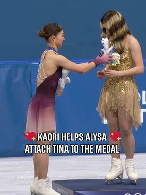 We love this podium moment! 😍 When Sakamoto Kaori showed Alysa Liu how to attach Tina to the strap of the medal. #Olympics #WinterOlympics 
