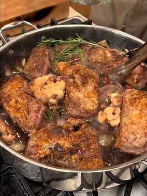 These are the Braised Short Ribs I made the night I propose marriage to Nancy! Worth noting,our son Philip ate this for breakfast, lunch and dinner the next day.. they are truly that good.  We used the new @HexClad  10qt Deep Saute pan that held 10 large short ribs and they were cooked to perfection!   Braised Short Ribs Ingredients: 8 bone-in short ribs Salt + cracked pepper ½ cup flour Oil for searing 1 onion, chopped 3-4 celery stalks + 3-4carrots, chopped 2 garlic bulbs, halved crosswise 4–6 sprigs rosemary 1 bottle red wine 1 box beef broth ¼ cup brown sugar 4 tbsp butter 2-4 tbsp peppercorns Directions: Preheat oven to 350°F. Pat short ribs dry, season generously with salt and pepper, then dredge lightly in flour. Heat oil in a large Dutch oven over medium-high heat and sear ribs on all sides until deeply browned (about 2–3 min per side). Remove and set aside. Lower heat to medium. Add onion, celery, and carrots to the pot and sauté until softened and lightly golden. Add halved garlic bulbs and rosemary sprigs, stirring briefly until fragrant. Pour in red wine and beef broth, scraping up all the browned bits. Stir in brown sugar and peppercorns and bring to a gentle simmer. Return short ribs to the pot, nestling them into the liquid. Cover and braise in the oven for about 3 hours, or until meat is fall-off-the-bone tender. Remove ribs and keep warm. Strain the cooking liquid into a saucepan and simmer 15–20 minutes until reduced. Whisk in butter to finish the gravy. Garlic Mashed Potatoes Ingredients  8 russet potatoes, peeled / cut   1 stick butter  20 cloves garlic, minced  2 cups whole milk  Salt, to taste  1–2 cups shredded mozzarella Directions 1.    Boil potatoes until fork tender. 2.    Drain and mash in a large bowl. 3.    Blend in milk until smooth. 4.    Melt butter with garlic; mix in. 5.    Salt to taste. 6.    Fold in mozzarella while hot. #shortribs #marryme #proposal #braised #hexcladpartner
