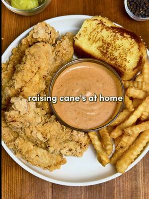 Raising Cane’s at Home 🐔🏠 For ALL of you asking - the app link for Osta is in my bio or you can search “Osta Recipes” on the App Store or Google Play store ‼️🫶 Crispy buttermilk chicken tenders, addictive Cane’s sauce and fluffy texas toast… all at home!  For the Chicken: -2 lbs (0.9 kg) chicken breast, sliced into strips (or use tenderloins) -2 cups buttermilk -1/3 cup pickle juice -Seasonings: 1 tsp garlic powder, 1 tsp paprika, 1 tsp onion powder, 1 tsp salt, 1 tsp black pepper -Neutral oil, for frying Flour Mixture: -2 cups all-purpose flour +1/2 cup cornstarch -1 tsp baking powder -Seasonings: 2 tsp garlic powder, 2 tsp paprika, 2 tsp salt, 2 tsp black pepper Cane’s Sauce -1/2 cup mayonnaise -1/4 cup ketchup -2 tsp Worcestershire sauce -Seasonings: 1 tsp garlic powder, 1 tsp onion powder, 1 tsp paprika, 1 tsp black pepper, 1 tsp seasoning salt Instructions: 1. Slice the chicken breasts into strips about 1 inch thick and 3–4 inches long (roughly tender-sized). In a bowl, whisk together the buttermilk, pickle juice, and chicken seasonings until fully combined. Add the chicken and toss to coat. Cover and refrigerate for at least 2 hours, or overnight for extra tender chicken. 2. In a large bowl, combine the flour, cornstarch, baking powder, and flour mixture seasonings. Mix. 3. Add neutral oil to a large pot or deep skillet until it is about 2–3 inches deep. Heat the oil to 350°F / 175°C.  Keeping the oil around this temperature ensures crispy chicken without burning the coating. 4. Drizzle a little buttermilk marinade into the flour mixture and stir to create flaky, crispy bits. Shake excess marinade off the chicken, then coat each piece thoroughly in the flour mixture. Shake off any extra flour and gently place into the hot oil. 5. Don’t touch them for the first 1–2 mins, that’s how you get the perfect crust. Fry for 7–10 mins, or until golden brown and cooked through. Transfer the chicken to a paper towel-lined rack to drain. 6. In a bowl, combine all the sauce ingredients then refrigerate.  7. Serve the chicken with a side of sauce, texas toast & crinkle fries… Enjoy :) #dinner #raisingcanes #chicken #tiktokrecipe #recipesoftiktok #dinneridea #homecooking