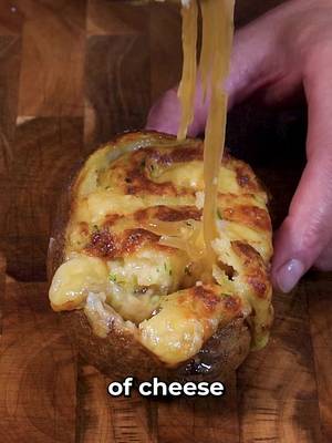 French Onion Soup Twice Baked Potato INGREDIENTS & RECIPE👇🏻 4 large russet potatoes 4 cups thinly sliced white onions 1/4 cup fresh thyme 1/2 cup salted butter 4 cups beef stock 1/4 cup Sherry cooking wine  1/4 cup creme fraiche or sour cream 1/4 cup chopped parsley 1/4 cup  softened garlic butter  1 cup grated  Gruyère cheese 1/2 cup cubed Swiss cheese 2 tbsp onion powder 2 tbsp garlic powder 1 tsp salt and pepper Melt butter in a large saucepan or pot over medium-low heat (enough to hold the cooked down onions and beef stock) Add the onions and cook, stirring frequently, until they reduce by half and become translucent (do not brown them) Add the thyme, beef stock, and sherry. Season with salt and pepper. Simmer on low for 30 minutes For the potatoes, pierce them with a fork and coat them in olive oil Bake at 425°F for an hour Slice off the top and carefully scoop out the inside add it to a bowl with the grated Gruyère cheese, parsley, sour cream or creme fraiche, garlic butter, onion powder, garlic powder and a pinch of salt.  Add it to a piping bag or a Ziploc bag Carefully ladle the soup and onions into the hollowed out potato Add some of the mashed potato mixture on top Place a few Swiss cheese pieces on top of the mashed potatoes.  Bake in a 450 degree oven for about 10 minutes or until the top is golden brownand hte cheese is melted  