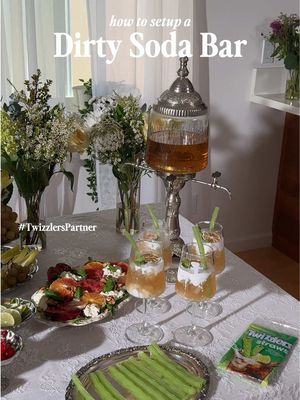 How to build a Dirty Soda Bar with @TWIZZLERS Twists #TwizzlersPartner🥤 Our favorite reality TV series is back, so I’m hosting a little watch party with the girls — and making a signature soda! Start with one base, then set out the add-ons: 🍋 Base: lemon-lime soda 🌿 Garnishes: mint + thyme, maraschino cherries, dehydrated fruit, fresh citrus, edible flowers 🍓 Syrups: passionfruit, lychee, guava (tropical flavors are always a win) 🥛 Finish: a splash of creamer or heavy cream And my favorite part: Twizzlers Straws as the straws! They’re edible, give you a sweet chewy sip, and you get a little snack at the end. Grab them exclusively on @Gopuff in select cities or visit shop.hersheys.com while supplies last! #TwizzlersStraws