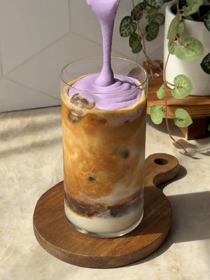making the ube coconut macchiato at home using @Califia Farms Toasted Coconut Almondmilk and paired with a creamy ube coconut cold foam💜✨ #CalifiaPartner  🥥 ube cold foam: froth 2 tbsp coconut cream, 15ml ube syrup, and a splash of Califia Farms Toasted Coconut Almondmilk until well combined  🥥 add ice, simple syrup to taste, and 3/4 cup Califia Farms Toasted Coconut Almondmilk to a glass  🥥 pour 2 shots of espresso on top  🥥 top with the ube cold foam and garnish with coconut flakes 
