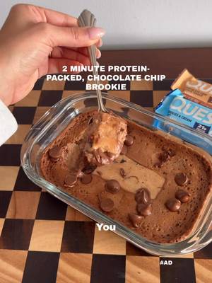 This single-serve chocolate chip brookie is too easy + made with one of my OG faves @questnutrition 🤌 #QuestPartner  Ingredients:  • 1 Chocolate Chip Cookie Dough Quest Bar  • Splash of milk  • 1 egg  • 1 cup cottage cheese  • 1 tbsp cocoa powder  • 1 tbsp flour (I used oat)  • Spoonful (or two) of chocolate chips  How to make: Blend everything, pour into a microwave-safe dish, and place 1 Chocolate Chip Cookie Dough Quest Bar in the center.  Microwave 60–90 seconds, checking every 15 so it doesn’t burn. Enjoy 🤍 Available at Costco and via SameDay.Costco. Check the link in my bio to find availability at your local Costco.  #TopQuestBarsAtCostco #OnAQuest #itsbasicallycheating 