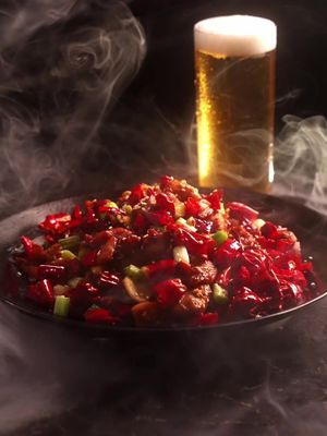 Laziji 🥵 is a famous spicy chicken dish from sichuan With so many peppers, you have to dig for the addictive bites of chicken while you drink and yap with your friends.  Here’s how you can make it: - cut up some dried chilis of your choice - deseed them by shaking them in a colander - soak them in some hard liquor to bring out fragrance - velvet your chicken with soy, dark soy, sugar, msg, shaoxing cooking wine, sugar, and a bit of cornstarch, white pepper - deep fry or stir fry your chicken and strain for later - toast your chili peppers, sliced ginger, garlic, and sichuan peppercorns - add in your chicken and some chopped green onions - season to taste - serve - dont die from the spice  Thanks for watching :) comment ‘chili’ if u actually read this lol