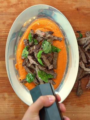 It was supposed to be well done I swear Detailed recipe link in bio! This steak idea came from a trip with @getprovecho where @Zachary Neman and I were cooking steak for the group, and needed a quick way to boost the flavor of the steak with what we had on hand.  We were pretty blown away when we took a bite after dressing the steak, so I think it’s only fitting I share this method with u all. #grilling #romesco #steaksauce 