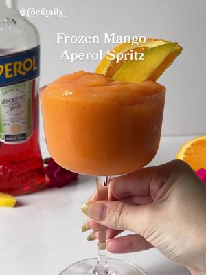 Summer in a glass. 🥭 -1 cup frozen mango -3 oz. Aperol -2 oz. orange juice -2 oz. prosecco -handful of ice -sliced orange and mango for garnish #frozencocktails #aperolspritz #aperol #mango #Summer 
