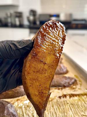 This why I don’t trust everybody at the cookout… I’ve seen how some of y’all treat sweet potatoes. This how they supposed to look… caramelized, rich, and doing something. Respectfully. 🤌🏾🎨 Caramelized Baked Sweet Potatoes Ingredients 4 medium sweet potatoes, cleaned 1/3 cup olive oil 2 tbsp maple syrup 1/2 tsp salt 1/2 tsp black pepper 1/2 tsp cinnamon 1/2 tsp vanilla extract Instructions Grab 3–4 medium sweet potatoes and slice them lengthwise, right down the middle. In a bowl, combine the olive oil, maple syrup, cinnamon, salt, pepper, and vanilla extract. Whisk everything together until it forms a smooth, lightly thickened mixture. Add the sweet potatoes to the bowl and coat them evenly, making sure the flat side is fully covered. Line a baking sheet with parchment paper and place the sweet potatoes flat side down. Bake at 400°F for 50–55 minutes, until the bottoms are deeply caramelized and the centers are tender. Let them cool for at least 10 minutes before moving them. This step is important as it allows that caramelized layer to set and release clean from the pan. #sweetpotato #potato #food #healthy #FoodTok 