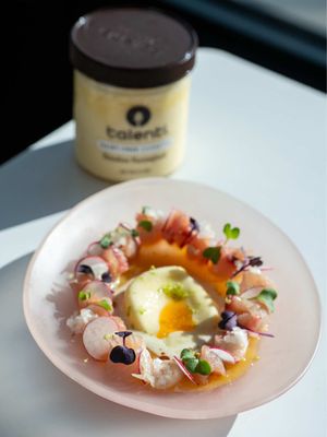 When life gives you Talenti, build the perfect crudo. #TalentiPartner I paired their new Paradise Passionfruit Sorbetto with fresh crudo for the dreamiest sweet-bright bite. You can find both Paradise Passionfruit Sorbetto and Chocolate Hazelnut Crunch Gelato at your nearest store. @Talenti Gelato #TalentiGelato #TalentiSorbetto Paradise Passionfruit Hamachi Crudo Yields: 2 as an appetizer Prep Time: 10 minutes Cook Time: 5 minutes Ingredients For the Crudo 4 oz hamachi, sashimi grade, very cold 2 fresh passionfruit ½ large orange, freshly juiced 1 tsp rice vinegar 1 tsp mirin 1 tsp soy sauce Kosher salt, to taste 2 radishes, paper thin ½ small shallot, minced Micro cilantro Flaky sea salt Fresh lime zest 1 scoop Talenti® Paradise Passionfruit Sorbetto Habanero oil, to taste Instructions Lightly salt the hamachi and place it in the freezer for 15 to 20 minutes to firm up. Using a very sharp knife, thinly slice against the grain. Keep chilled in the fridge until ready to plate. Make the crudo sauce: In a jar, combine passion fruit pulp, fresh orange juice, rice vinegar, mirin, soy sauce, and a pinch of salt. Blend on high for 1 minute, then strain through a fine mesh sieve. Set aside. To assemble, arrange the sliced hamachi in a circle on a serving plate. Layer with thinly sliced radishes, shallots, and microgreens. Place a generous dollop of Talenti Paradise Passionfruit Sorbetto in the center and drizzle with habanero oil. Spoon the passion fruit sauce around the fish, then finish with lime zest and flaky sea salt. Serve immediately and enjoy.