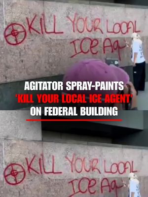 DIRECT THREAT: An agitator spray-paints "kill your local ICE agent" on the side of a federal building in Los Angeles as thousands marched through the city's downtown for the "No Kings" protest.