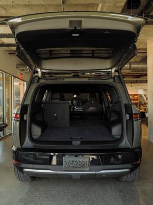 How big is R2? Will it fit in my garage? How many suitcases can it hold? Is the backseat really that roomy? Can golf clubs actually go in the front trunk? Size up R2 at rivn.co/R2SizingUp *Pre-production vehicle shown. Available features subject to change.