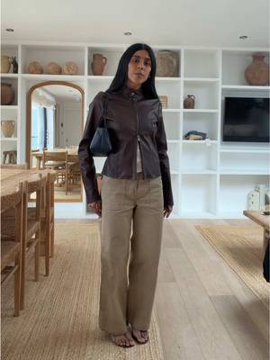 90’s VB is the inspo - leather jacket is Nour Hammour - vest is @leset - cargos are Redone - bag The Row - heels are @STAUD  #leatherbiker #therowterrassebag #90saesthetic 