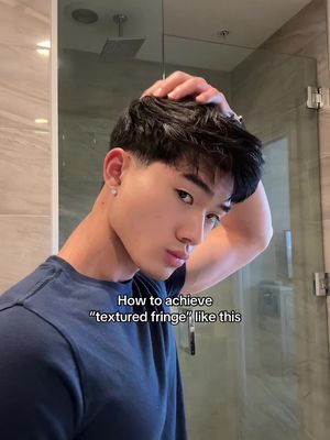 If you want the textured fringe, it comes down to 3 things: 1. Haircut: Ask for a 1-3 guard taper on the back and sides (not a crisp tade but cleanup look). Keep the top and high sides a nice length and debulk/thin if your hair is thick like mine. Trim bangs 1/2-1inch length 2. Product: Use @BASED sea salt for volume and separation, then add a dime sized amount of clay.  Use both for a hatural'shiny hold his and clean texture 3. Styling: Work on damp hair. Apply texture spray first, then clay lightly, while scrunching and pushing the front slightly forward and outward to create that relaxed shape #asianhair #hairtok #hairstyling #hairtutorial #hairroutine 