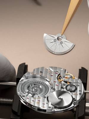 The Unseen Artistry Beneath the elegant profile of the Overseas Self-Winding Ultra-Thin, a world of meticulous craftsmanship unfolds. The Manufacture Calibre 2550, a testament to the Maison's pursuit of ultra-thin watchmaking, reveals its intricate architecture Every component, from the innovative five-wheel gear train to the double-level flying barrel, is a study in precision. Meanwhile, the platinum micro-rotor, with its emblematic compass rose, orchestrates the timepiece's enduring performance. Finally, through the sapphire caseback, one discovers bridges adorned with Côtes de Genève and hand-bevelling. #VacheronConstantin #OneOfNotMany