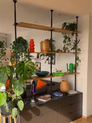 AD | I found the perfect way to split my studio apartment using this DIY shelf from Pamo Design as a room divider and it completely changed the space #apartment #roomideas #homemakeover 