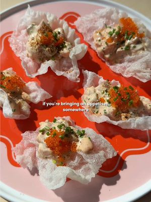 Spicy salmon on crispy rice crackers 🌶️🍘 .. and the cracker is just fried rice paper! Makes ~12 pieces 200g sashimi-grade salmon, finely diced 1 tbsp kewpie mayo 1 tsp sriracha/tobasco (adjust to spice level) ½ tsp sesame oil 1 tsp soy sauce 1 tsp lemon juice 2 tbsp spring onion, finely chopped 3 sheets of rice paper oil, for frying 1 tsp toasted sesame seeds Roe/tobiko, for garnish Shichimi Togarashi, for garnish 1. Fry the rice paper in hot oil until it instantly puffs up. Drain on paper towels, then break into smaller crisps  2. Dice the salmon into small cubes and place in a bowl. 3. Mix together mayo, sriracha, sesame oil, soy sauce, and lemon juice until smooth. 4. Fold the salmon, and spring onion into the sauce until evenly coated. Chill for 10 minutes. 5. Spoon a small mound of spicy salmon onto each rice cracker. 6. Sprinkle with shichimi togarashi and top with tobiko. Serve immediately so the crackers stay crisp. #appetizer #entertaining #dinnerparty #EasyRecipe #fypシ゚ 