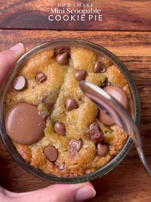 Ooey-Gooey Mini scoopable Cookie pie🤤 🤤 Yields: 7-8 mini Cookie pies  INGREDIENTS: •115g cold chopped unsalted butter •80g caster sugar •80g light brown sugar •220g chocolate chunks or chips( you can increase or reduce this according to your preference)  •238g plain flour  •½ tsp salt •1 & ½ tsp baking powder •¼ tsp baking soda •1 whole egg + egg yolk  •½ tsp vanilla •Nutella  INSTRUCTIONS: •In a large mixing bowl, add the cold cubed butter and whisk until slightly creamy. Add the white sugar and light brown sugar, then whisk together until well combined and fluffy. •Add the eggs, vanilla extract, and chocolate chips or chunks. Whisk until fully incorporated. •Add the flour, baking powder, baking soda, and salt. Gently mix until just combined, do not overmix. •Preheat oven to 175-180°C (350°F). •Take any shape mini baking dish circle, square, rectangle anything and Place the cookie dough and then add Nutella and another layer of cookie dough.  •Bake for 15-20 minutes (timing depends on the type of dish) or until the tops are lightly golden while the centres remain soft and gooey. •Remove from the oven and let cool slightly. •Serve warm with ice cream and chocolate sauce enjoy!✨ NOTE: Store any extra dough balls in an airtight container or freezer bag and freeze for later. Whenever a cookie craving hits, bake straight from frozen 🫶🏻 #cookie #chocolate #nutella #fyp #explorepage✨ 