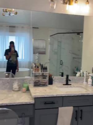 You can upgrade your entire bathroom without touching the layout—and most people overlook this one detail. Builder grade mirrors tend to visually cut the wall in half, reflect clutter, and keep the space from feeling custom. Swapping to taller mirrors + updated lighting + a deeper wall color instantly adds height, contrast, and a more elevated look. If your bathroom feels off but you can’t figure out why, start here before doing anything major. It’s a smaller change that can completely shift how the space looks and feels. #bathroomupgrade #buildergrade #bathroomdesignideas #homedecorideas #diyhome Would you keep builder grade mirrors or swap them out?